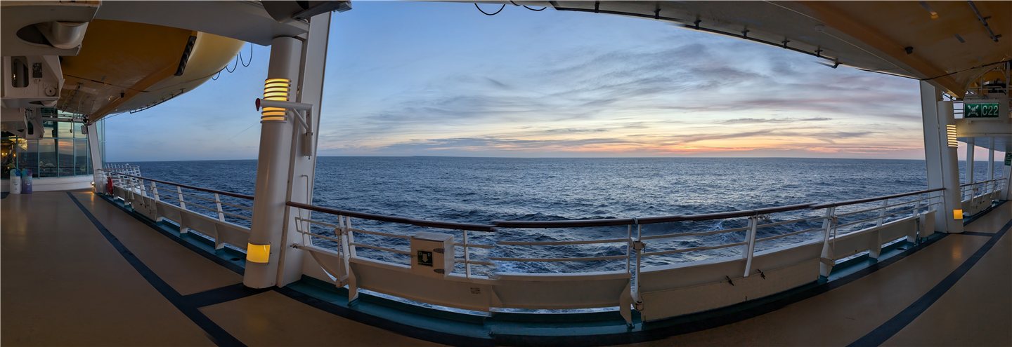 Panoramic view of the open ocean at sunset from the deck of Liberty of the Seas