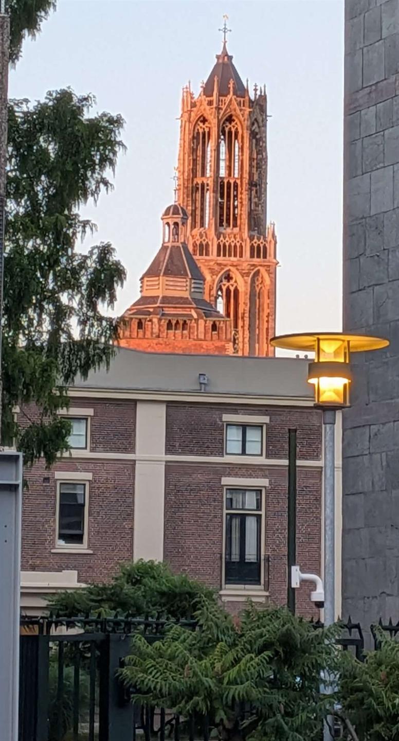 A cathedral tower visible above the Utrecht skyline