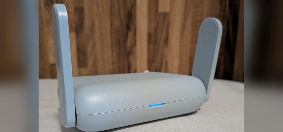 The GL.iNet Beryl AX travel router with its antennas raised