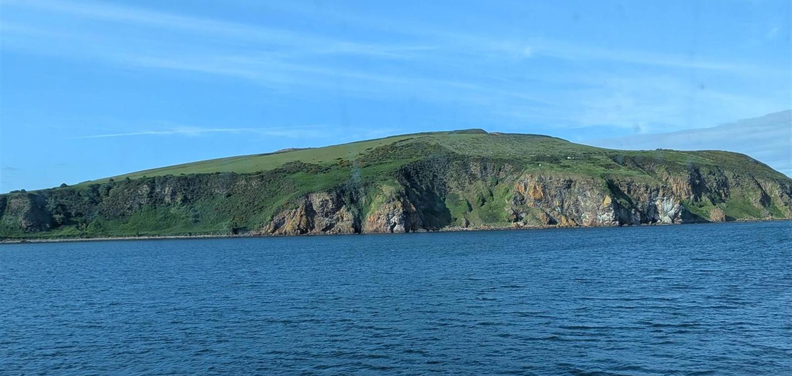 Approaching the Scottish coast by sea at dawn