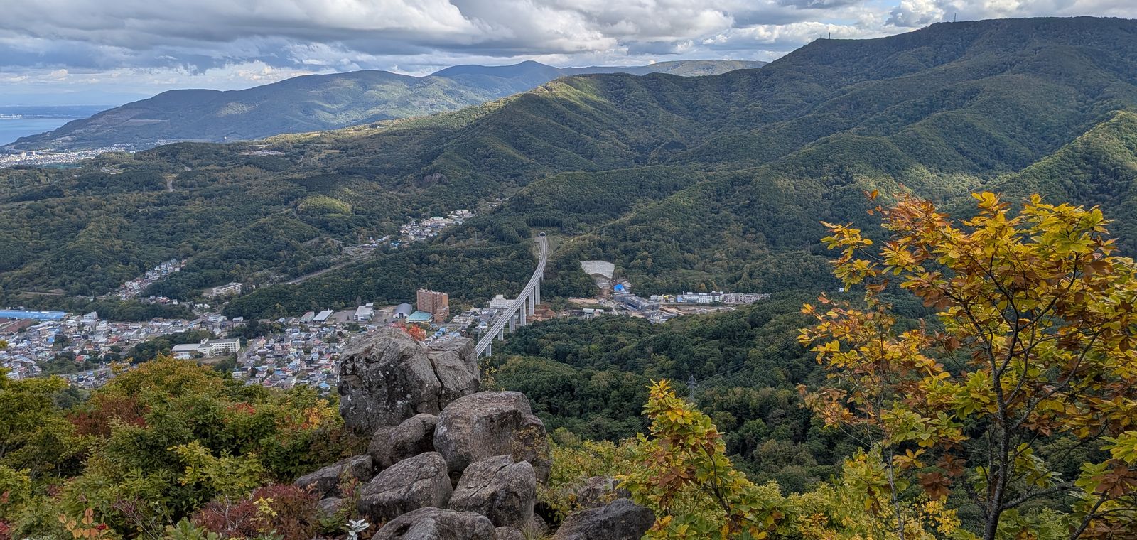 Autumn colors on the ridge of Mount Tenguyama above Otaru, with mountains beyond